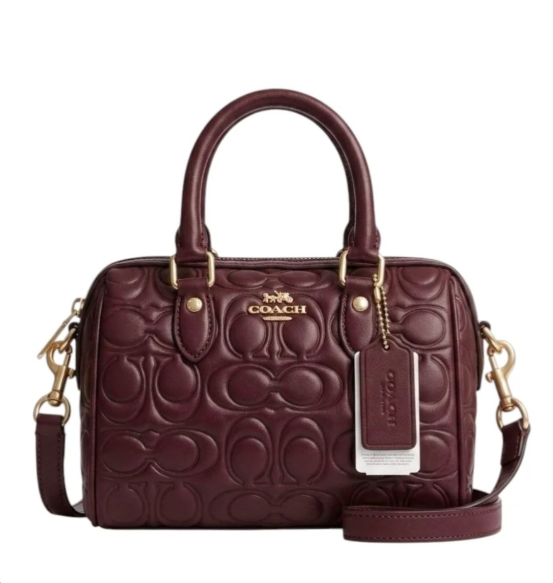 Sac polochon Coach en cuir gaufré bordeaux