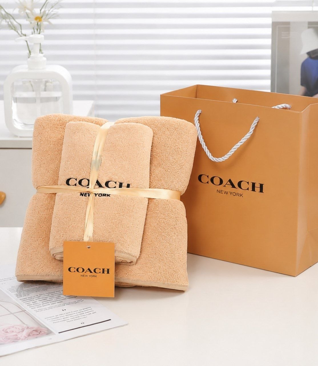 Serviette de bain Coach plusieurs coloris