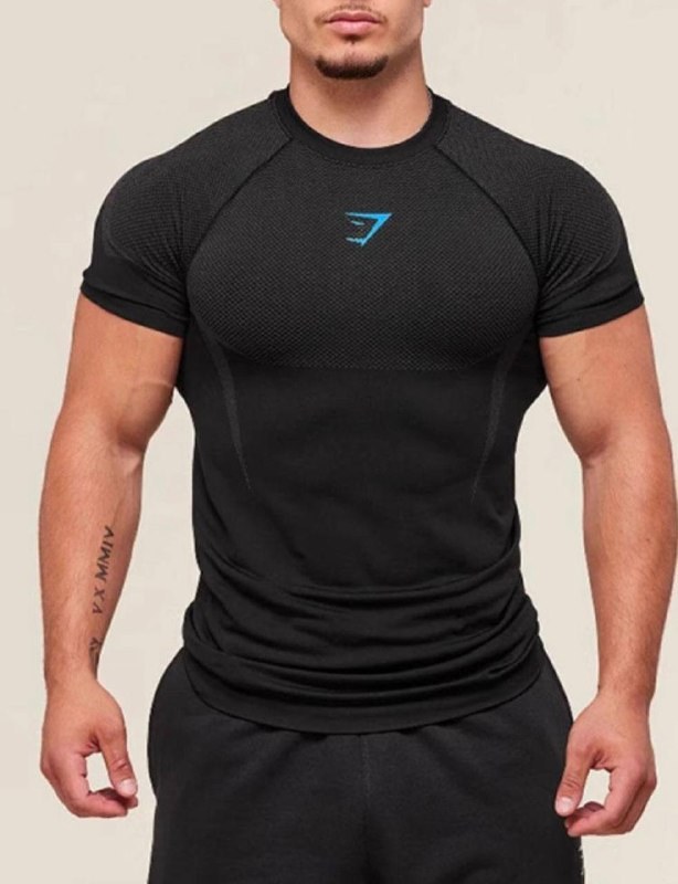 T-shirt compression Gymshark noir à logo bleu